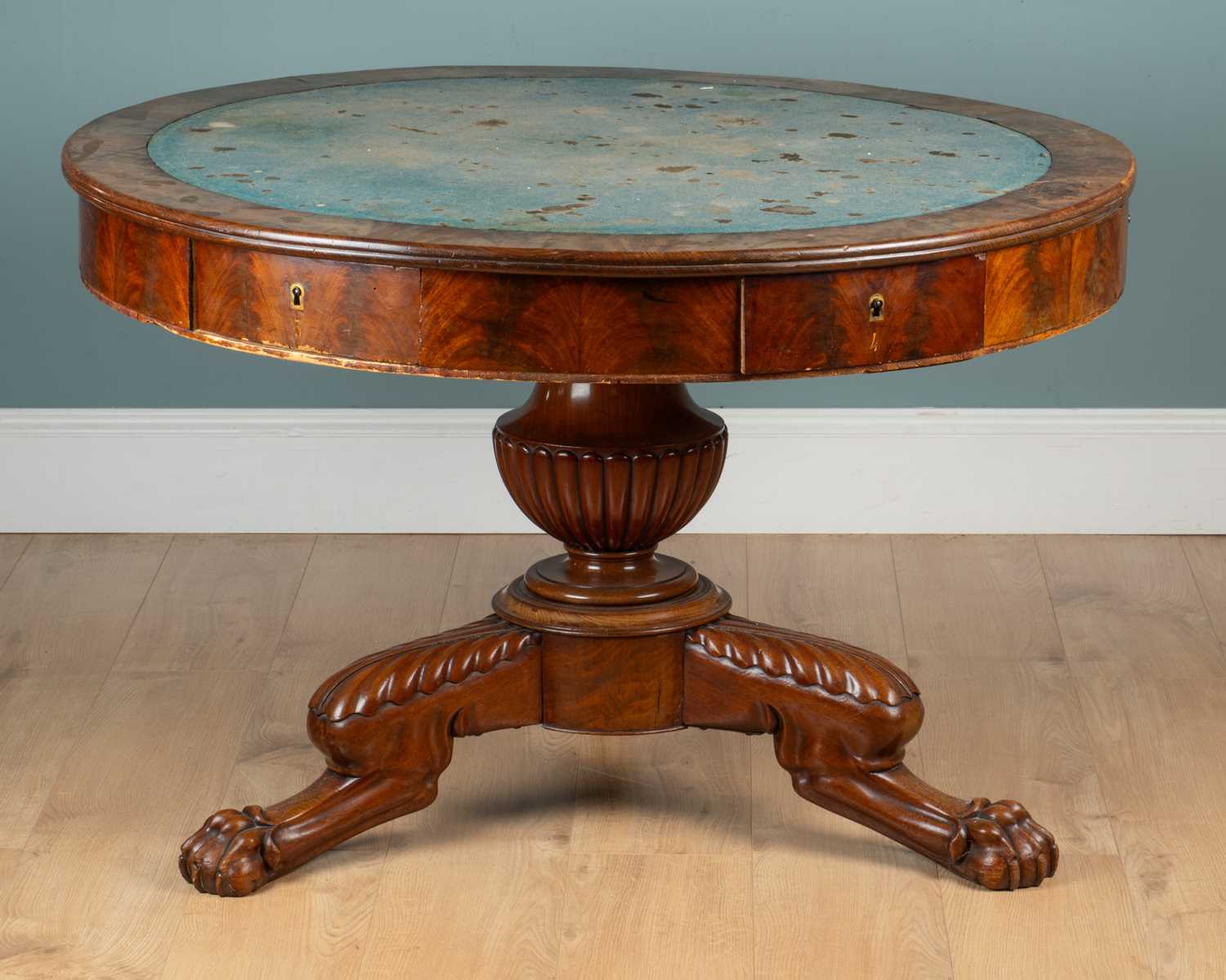Lot 480 - A 19th century baize-inset circular rent table