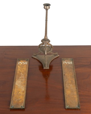 Lot 77 - A gilt metal candlestick and two door mounts