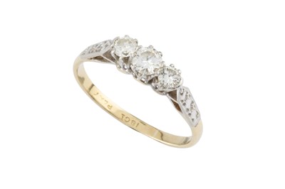 Lot 229 - A diamond three stone ring, the round...