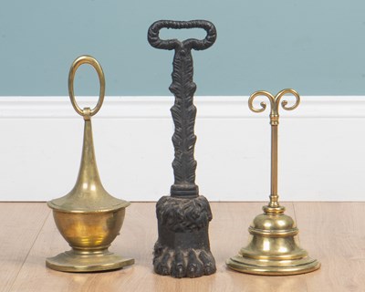 Lot 1069 - A group of six 19th century and later door porters or door stops