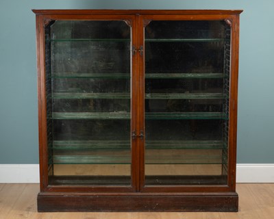 Lot 1210 - An early Arts & Crafts walnut display cabinet