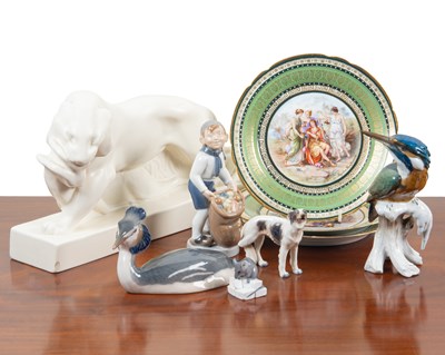 Lot 1312 - A collection of pottery and porcelain figurines and three plates