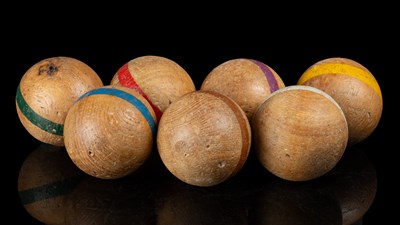 Lot 1430 - A collection of seven French walnut boules