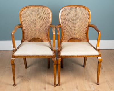 Lot 243 - A pair of 1930s bergère elbow chairs