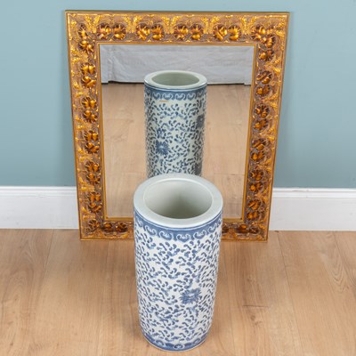 Lot 415 - A gilt wall mirror, together with a cylindrical stick stand