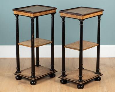Lot 55 - A pair of burr walnut and ebonised three-tier lamp tables