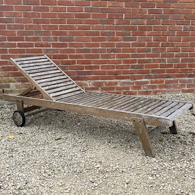 Lot 1419 - A teak sun lounger