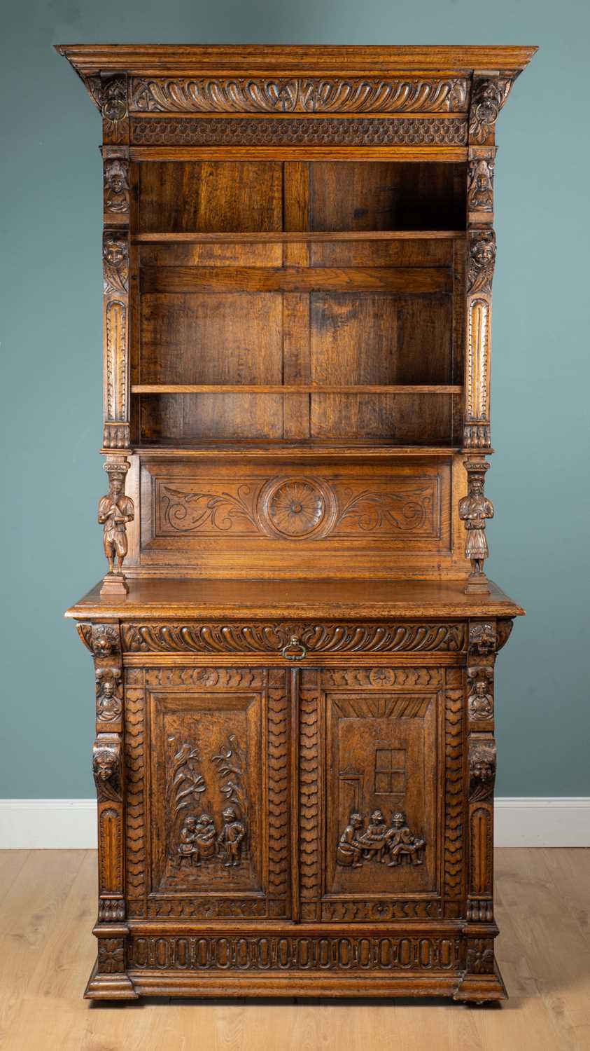 Lot 1087 - A Continental oak dresser with decorative carving