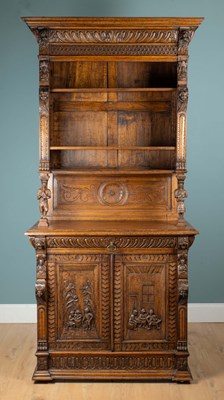 Lot 1087 - A Continental oak dresser with decorative carving