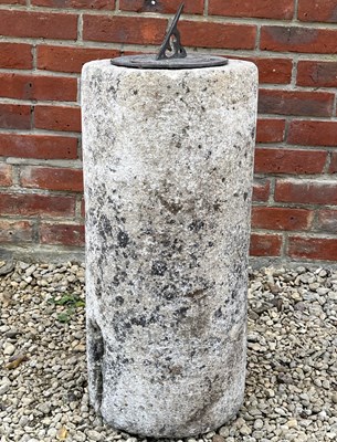 Lot 1459 - A sundial mounted on a rustic limestone column