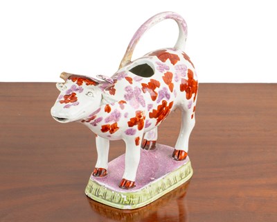 Lot 1158 - An early 19th century pottery cow creamer