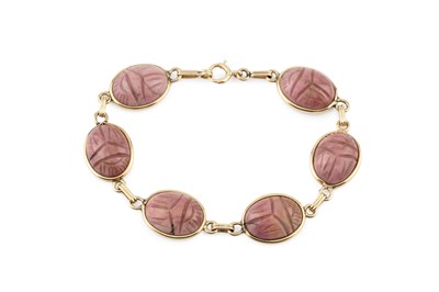 Lot 68 - A hardstone scarab bracelet, the oval carved...
