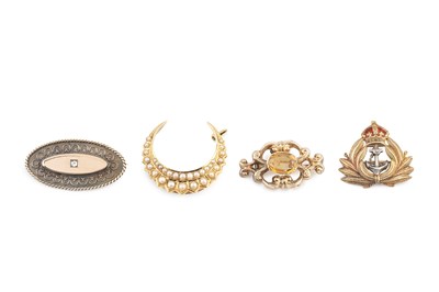 Lot 47 - A half pearl crescent brooch, stamped '18',...