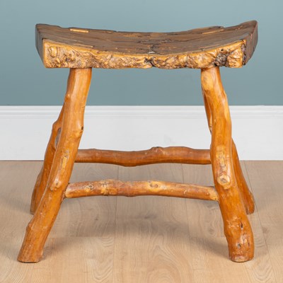 Lot 1232 - A rustic chamcha wood stool
