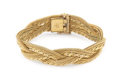 Lot 405 - A gilt metal costume bracelet by Christian...