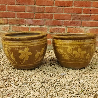Lot 1468 - A pair of Chinese egg pot-style planters