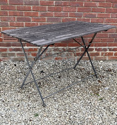 Lot 1408 - A garden table with a teak slatted top