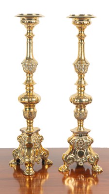 Lot 1225 - A pair of Dutch-style brass altar candlesticks