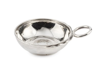 Lot 719 - A mid 19th century French silver taste-vin,...