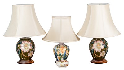 Lot 491 - Three Moorcroft table lamps and a Moorcroft box and cover