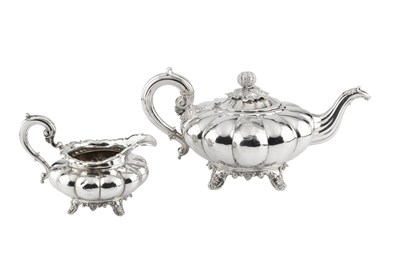 Lot A William IV silver teapot, of lobed and...