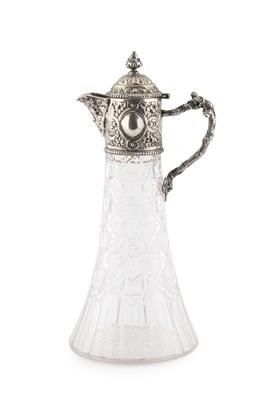 Lot 772 - A silver mounted claret jug, embossed with...