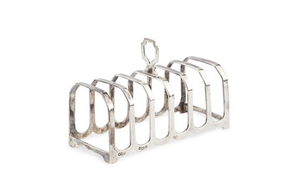 Lot 781 - A silver seven bar toast rack, by Henry...