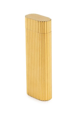 Lot 537 - A gold plated lighter by Cartier, of reeded...