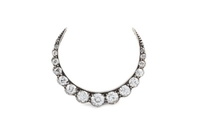 Lot 44 - A diamond crescent brooch, set with graduated...