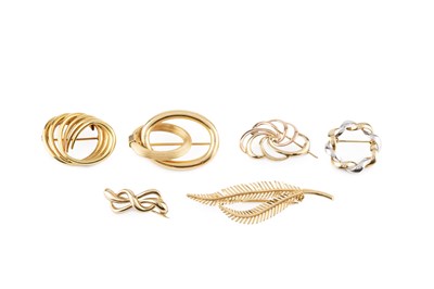 Lot 210 - A collection of panel brooches, the first...