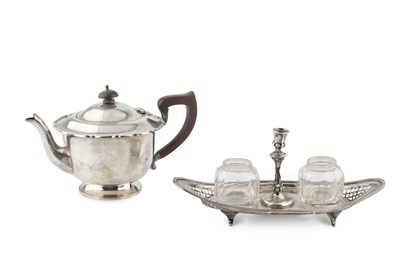 Lot 800 - An Edwardian silver teapot, of circular design...