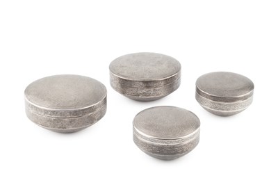 Lot 821 - A group of four Egyptian silver circular boxes...