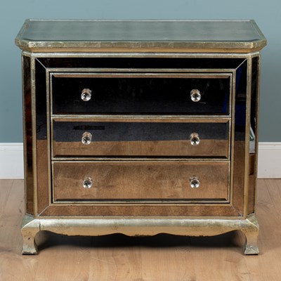 Lot 137 - A mirrored chest of drawers