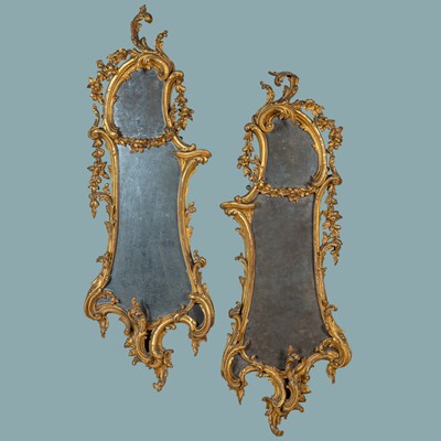 Lot 411 - A pair of 19th century Rococo-style pier mirrors
