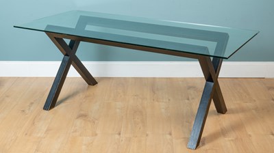 Lot 142 - A glass-topped kitchen table