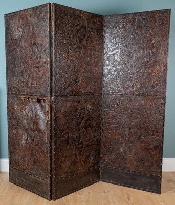 Lot 47 - A 19th century three-fold embossed leather screen