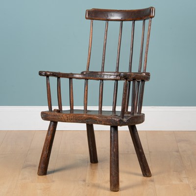 Lot 59 - A late 18th/early 19th century primitive elm Windsor chair