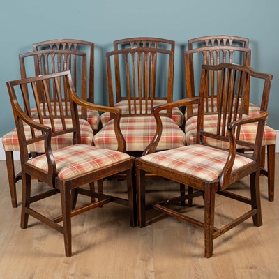 Lot 283 - A triple-pedestal dining table and eight chairs