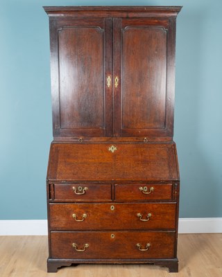 Lot 350 - A Georgian oak bureau bookcase