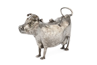 Lot A George II silver cow creamer, with engraved...