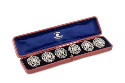 Lot 545 - A set of six Edwardian silver buttons, pierced...