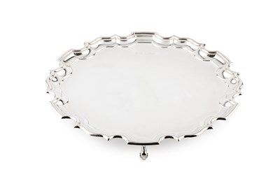 Lot 857 - A silver small salver, with shaped border, on...