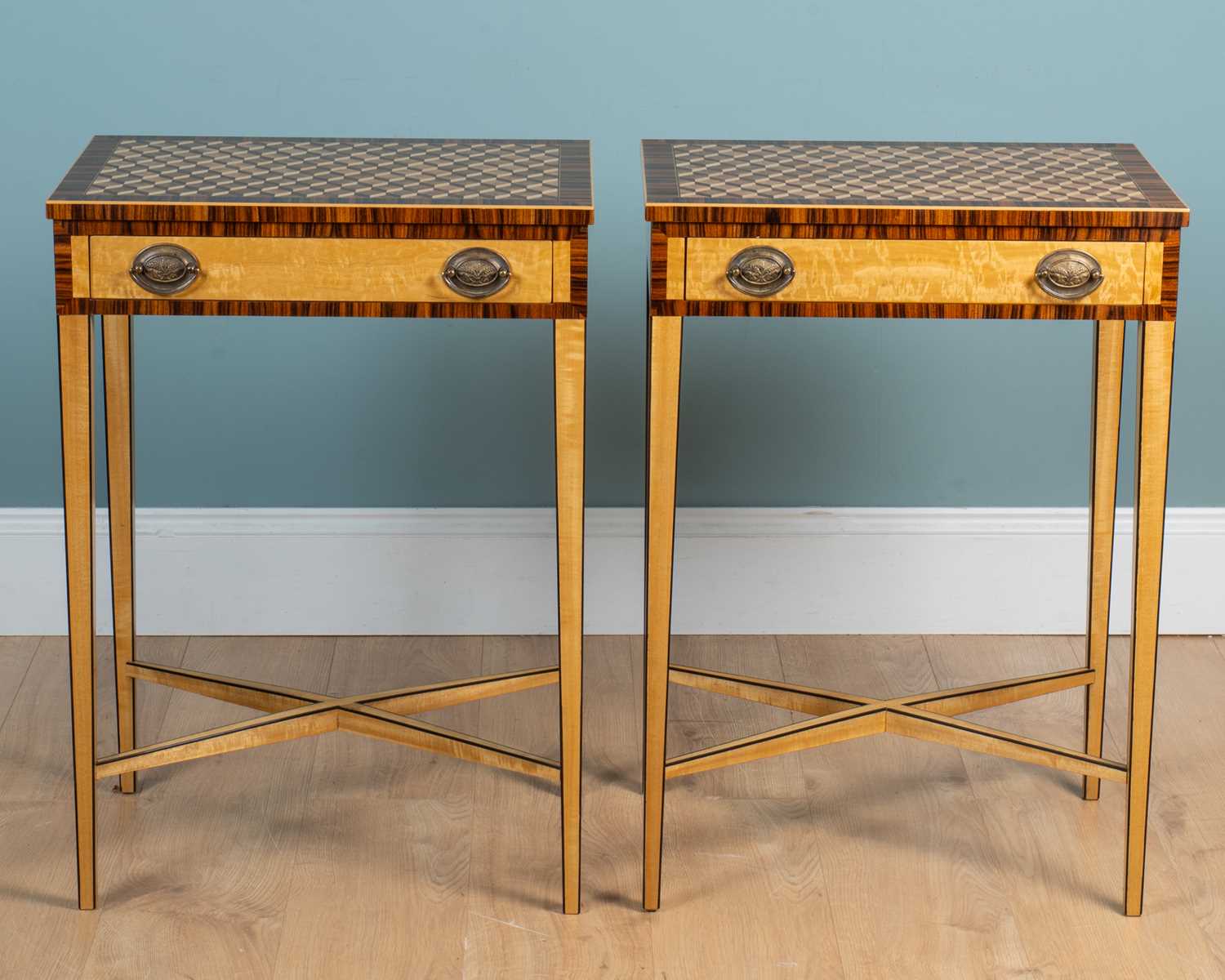 Lot 223 - A pair of satin birch lamp tables
