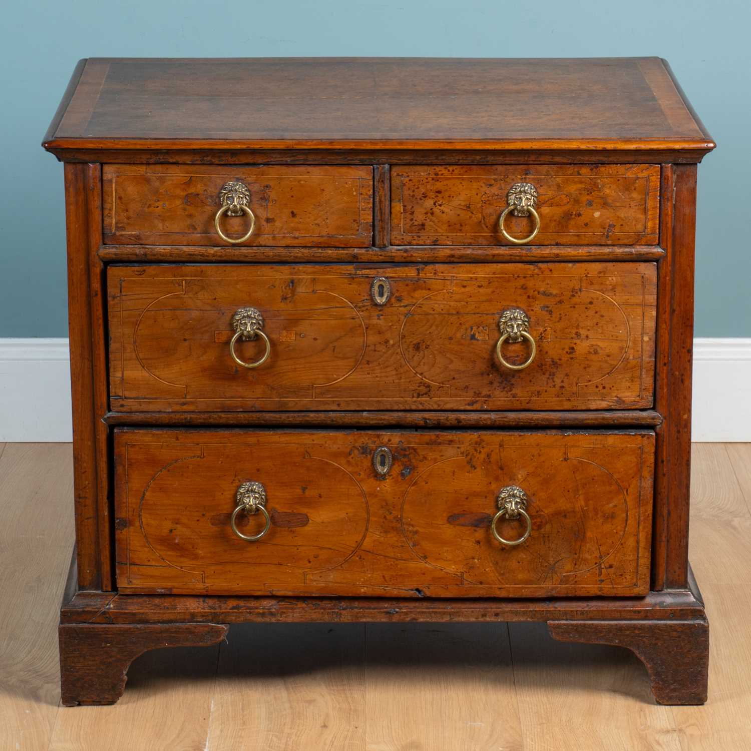 Lot 400 - A small yew wood chest of drawers