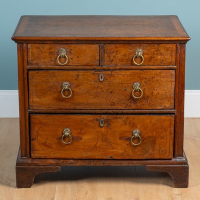 Lot 400 - A small yew wood chest of drawers