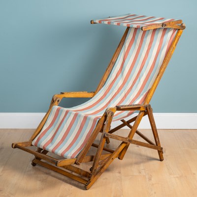 Lot 1053 - An old teak deck chair