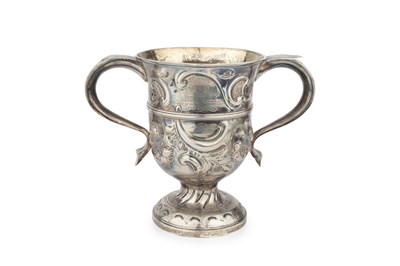 Lot 879 - A George II silver twin handled cup, later...