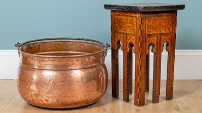 Lot 175 - A small middle eastern table and a copper cauldron