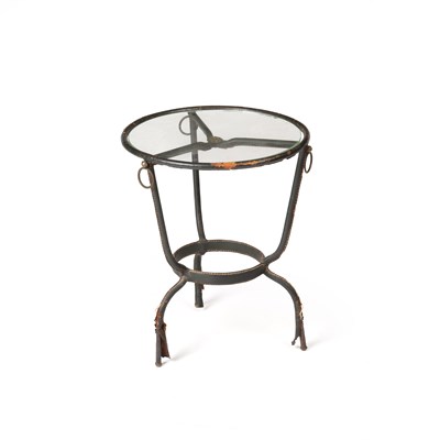 Lot 664 - Jacques Adnet (1900-1984)  Table leather bound...