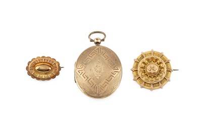 Lot 285 - A gilt metal oval locket pendant, decorated...